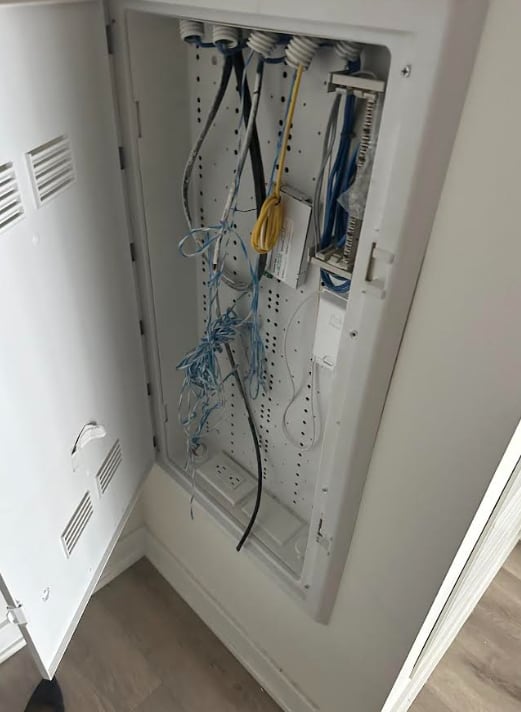 A damaged utility box within Tim Rye's Toronto condo. He says modems were removed from within the metal cabinet by the tenant��are missing.